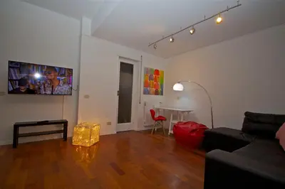 a living room with a couch and a table at PORTA PORTESE apartment in Rome