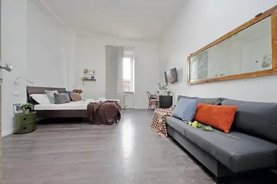 a living room with a couch and a bed at St Peter Giant Apartment in Rome