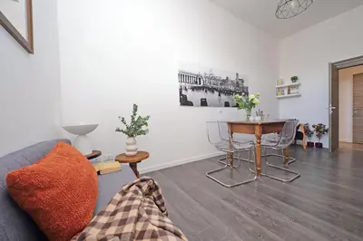 a living room with a couch and a table at St Peter Giant Apartment in Rome