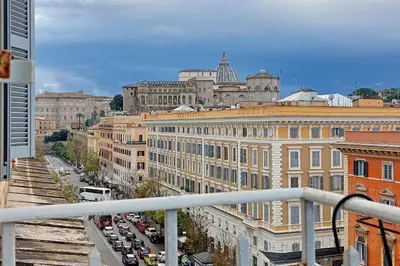 a view of a city with cars and buildings at St Peter Giant Apartment in Rome