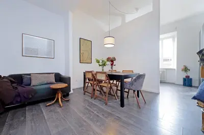 a living room with a table and a couch at St Peter Giant Apartment in Rome