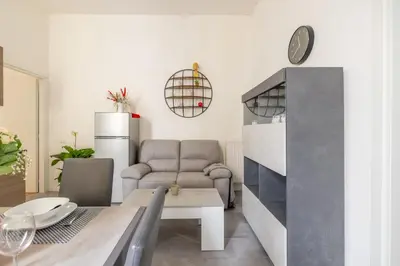 a living room with a couch and a table at ARGILLA PLACE Large apartment close to Saint Peter Basilica in Rome