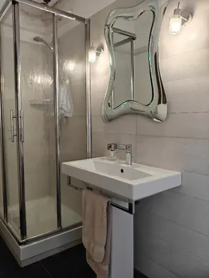 a bathroom with a sink and a shower at Gregorio VII Dream House in Rome