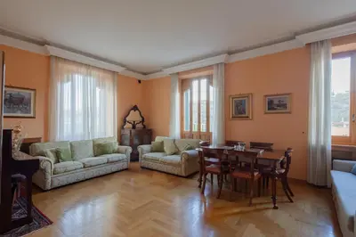 a large living room with a table and chairs at Tomas' house Clodio in Rome