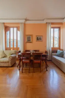 a living room with a table and a couch at Tomas' house Clodio in Rome