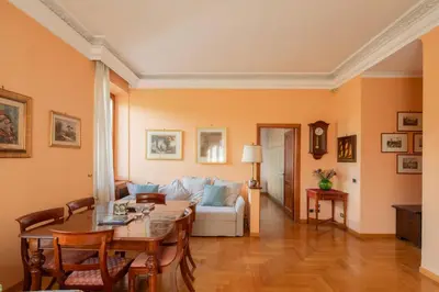a living room with a table and a couch at Tomas' house Clodio in Rome