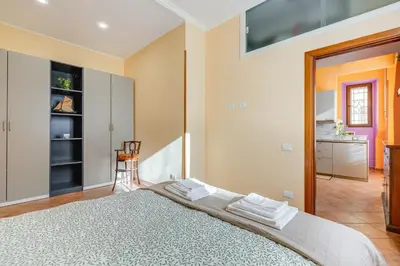 a bedroom with a large bed in a room at Casa Garbha in Rome