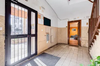 an empty hallway with a door and windows at Casa Garbha in Rome