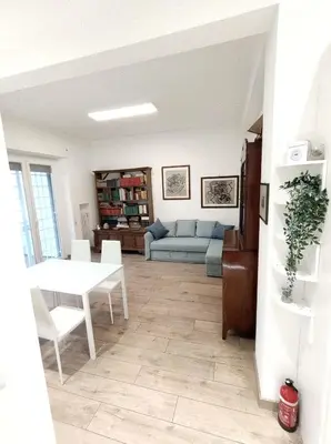 a living room with a table and a couch at Annalisa Home in Rome