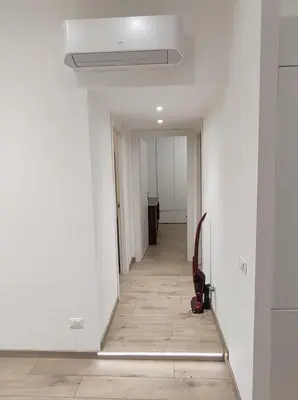 a hallway with white walls and a ceiling at Annalisa Home in Rome