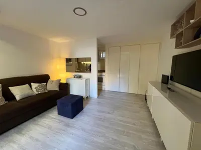 a living room with a couch and a television at LaDolcevita - Casa Milvia in Rome