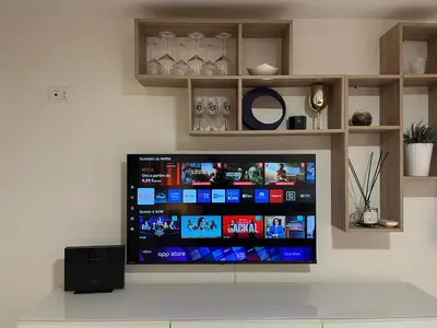 a flat screen tv sitting on a wall at LaDolcevita - Casa Milvia in Rome