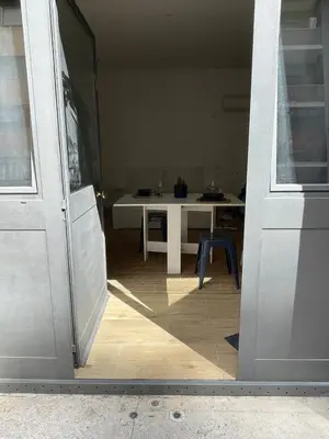an open door to a room with a table in the background at Suite San Giovanni in Rome