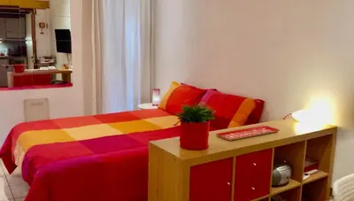 a bedroom with a bed and a table with a keyboard at Romeathome146 - Monti in Rome