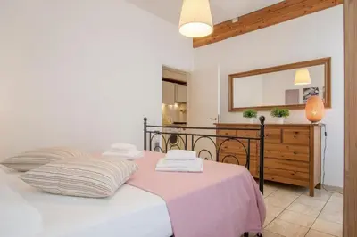 a bedroom with a bed with a mirror and a dresser at Romeathome146 - Monti in Rome