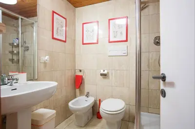 a bathroom with a white toilet and a sink at Romeathome146 - Monti in Rome