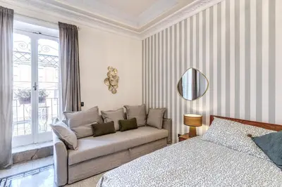 a living room with a couch and a mirror at Emily in Rome in Rome
