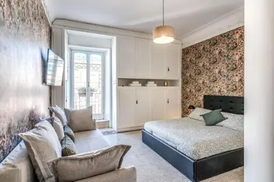 a bedroom with a bed and a couch at Emily in Rome in Rome