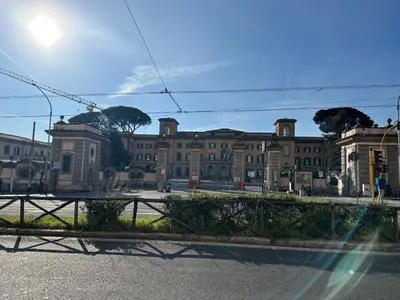 a large building in the middle of a street at Relais Trastevere Station in Rome
