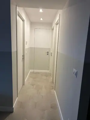 a hallway with a walk in shower and a glass door at Casa Roma Metro B Tiburtina in Rome