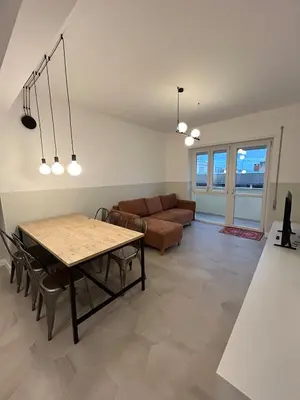 a living room with a couch and a table at Casa Roma Metro B Tiburtina in Rome