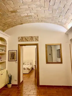 a room with a ceiling with a mirror and a bed at Sophia s Home in Rome