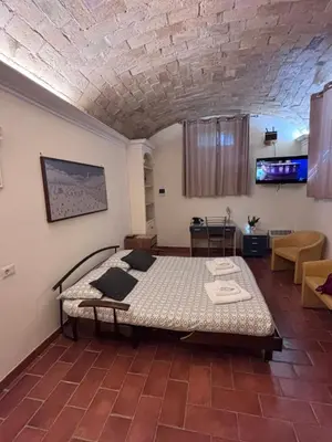 a bedroom with a bed in a room at Sophia s Home in Rome
