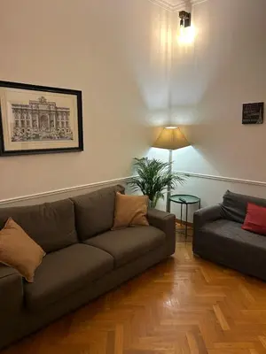 a living room with a couch and a table at loft 06 - new opening in Rome