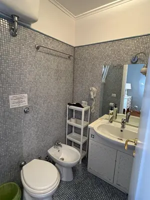 a bathroom with a toilet and a sink at loft 06 - new opening in Rome