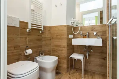 a bathroom with a toilet and a sink at Casa 901 - The Italian Stay Collection in Rome
