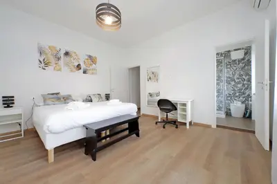 a bedroom with a bed and a desk and a chair at Trastevere 3 apartments by Flatinrome in Rome