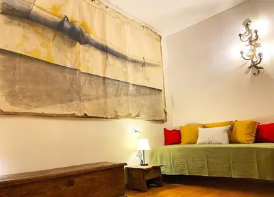 a room with a bed and a painting on the wall at Trastevere Advenida in Rome