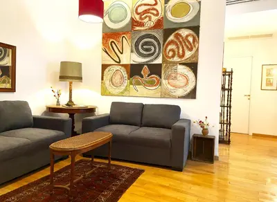 a living room with a couch and a table at Trastevere Advenida in Rome