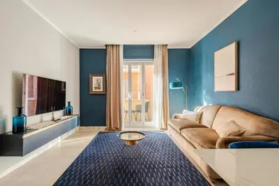 a living room with a couch and a tv at Elegant Home San Pietro vicino alla Metro in Rome