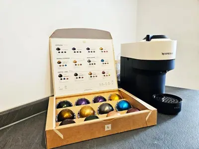 a box of balls sitting next to a ballophone at Elegant Home San Pietro vicino alla Metro in Rome