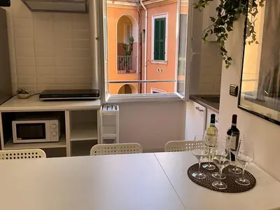 a kitchen with a table with wine glasses on it at Maria House Saint Peter in Rome