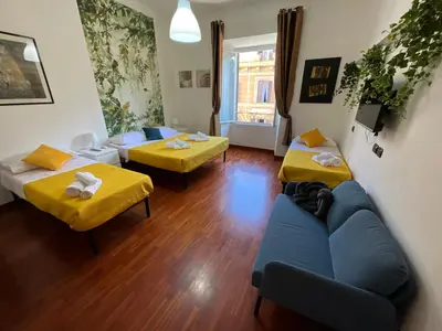 a living room with two beds and a couch at Maria House Saint Peter in Rome
