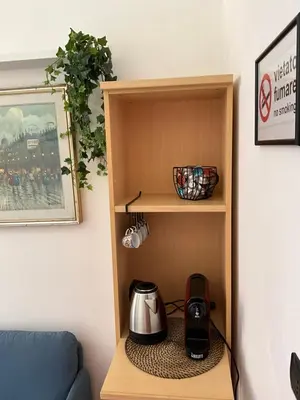 a wooden cupboard with a tea kettle on it at Maria House Saint Peter in Rome
