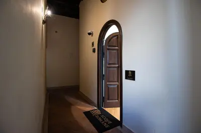 a hallway with an open door in a building at Acque Romane Fontana di Trevi M in Rome