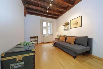 a living room with a couch and a table at Cozy Apartment Rione Monti in Rome