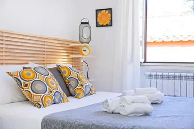 a bedroom with a bed with towels on it at Bella Nonna in Rome