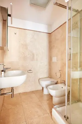 a bathroom with a sink and a toilet and a shower at Montevecchio Boutique Apartments in Rome
