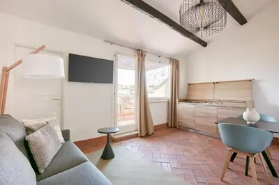 a living room with a couch and a table at Montevecchio Boutique Apartments in Rome
