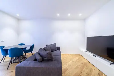 a living room with a couch and a table at Bellina Suite Hi Tech Apartment in Rome