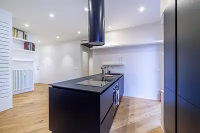 a kitchen with a black counter and a sink at Bellina Suite Hi Tech Apartment in Rome