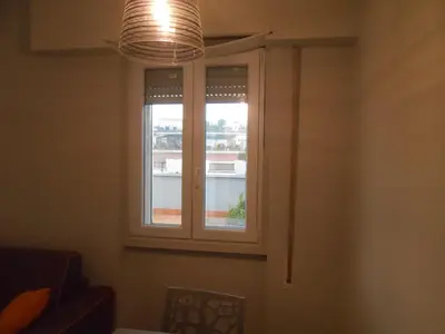 a window in a room with a light at Via Cipro in Rome