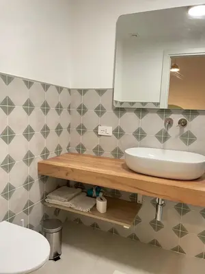 a bathroom with a sink and a mirror at Bed & Breakfast RCH Roman Central House in Rome