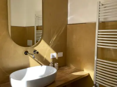 a bathroom with a white sink and a mirror at Bed & Breakfast RCH Roman Central House in Rome