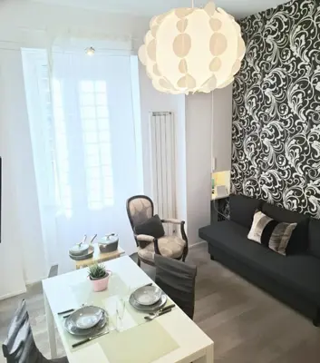 a living room with a table and a couch at Casetta Vaticano in Rome