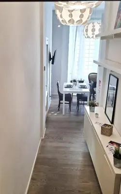 a hallway with a dining room and a dining table at Casetta Vaticano in Rome